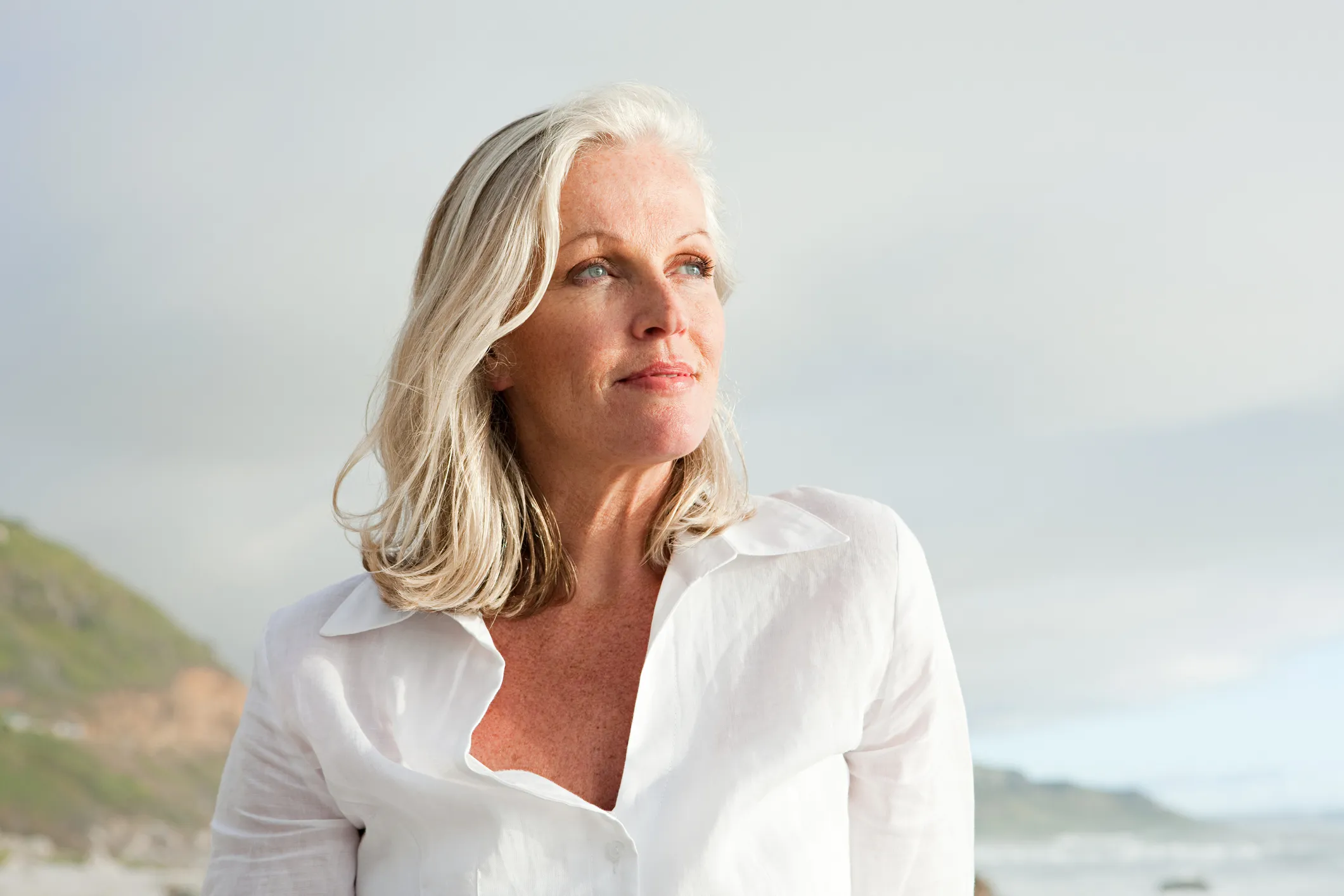 Woman with white hair at the beach